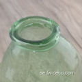 Minigrön färgad klar glasblomma vas